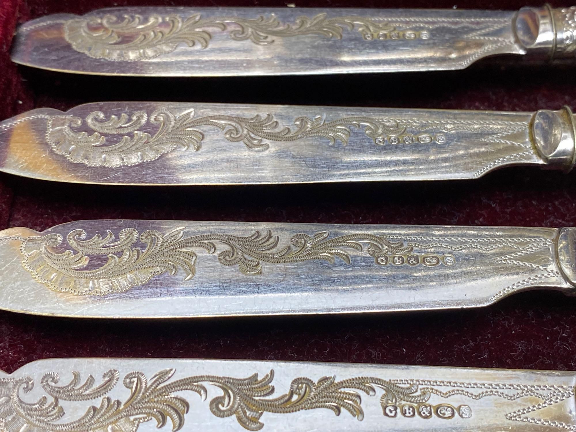 A Victorian rosewood cased set of eighteen plated dessert knives and forks, and two other cased sets of plated cutlery